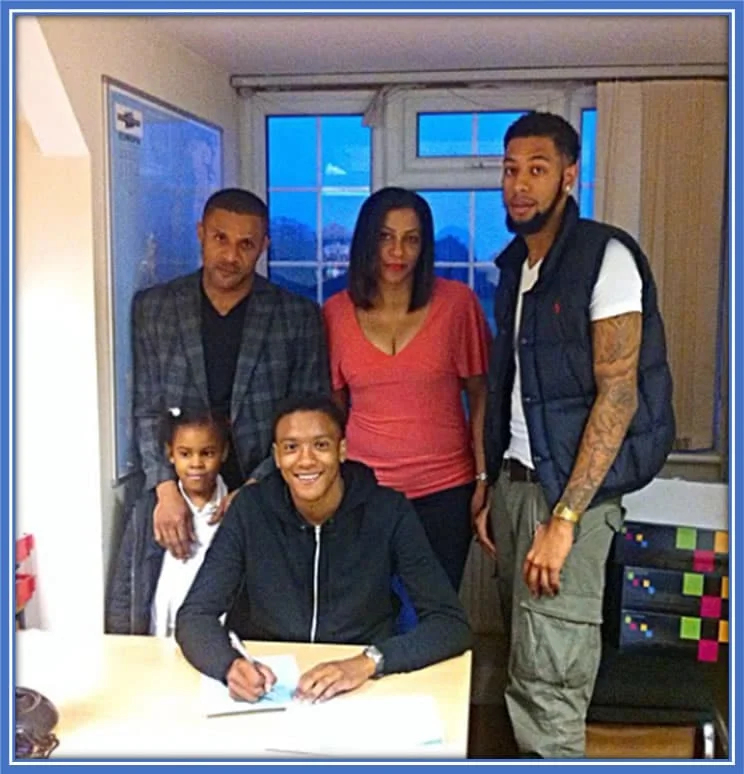 Konsa's Remarkable Journey: Signing His First Contract Surrounded by Unwavering Family Support. Credit: Instagram/ezrikonsa