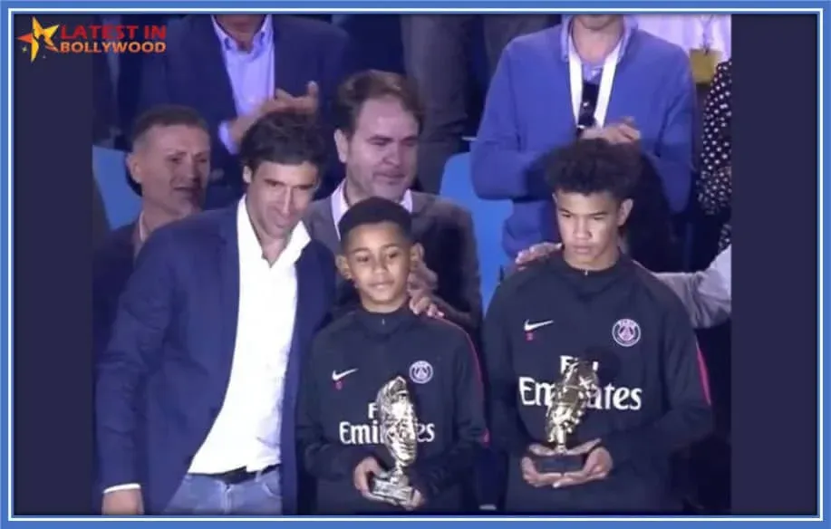 Emerging Champion: Young Prodigy Emery (on the left) beams with pride, clutching his hard-earned trophy. Credit:latestinbollywood.
