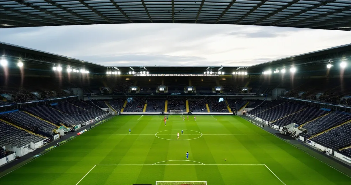 Empty football stadium with boots at center circle symbolizing retirement