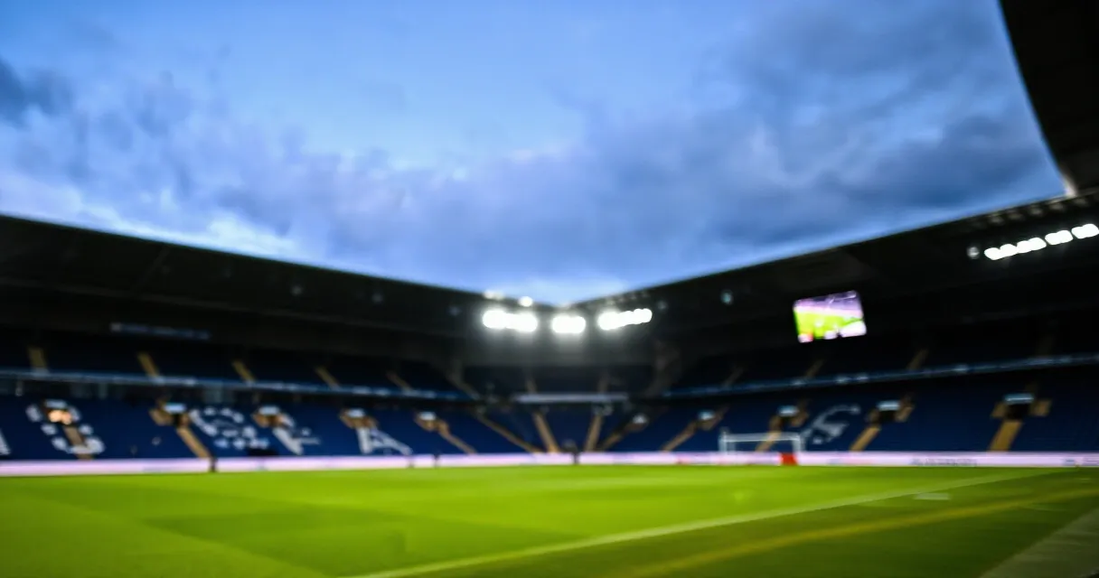 Aston Villa striker training on pitch, claret and blue kit, editorial sports photo