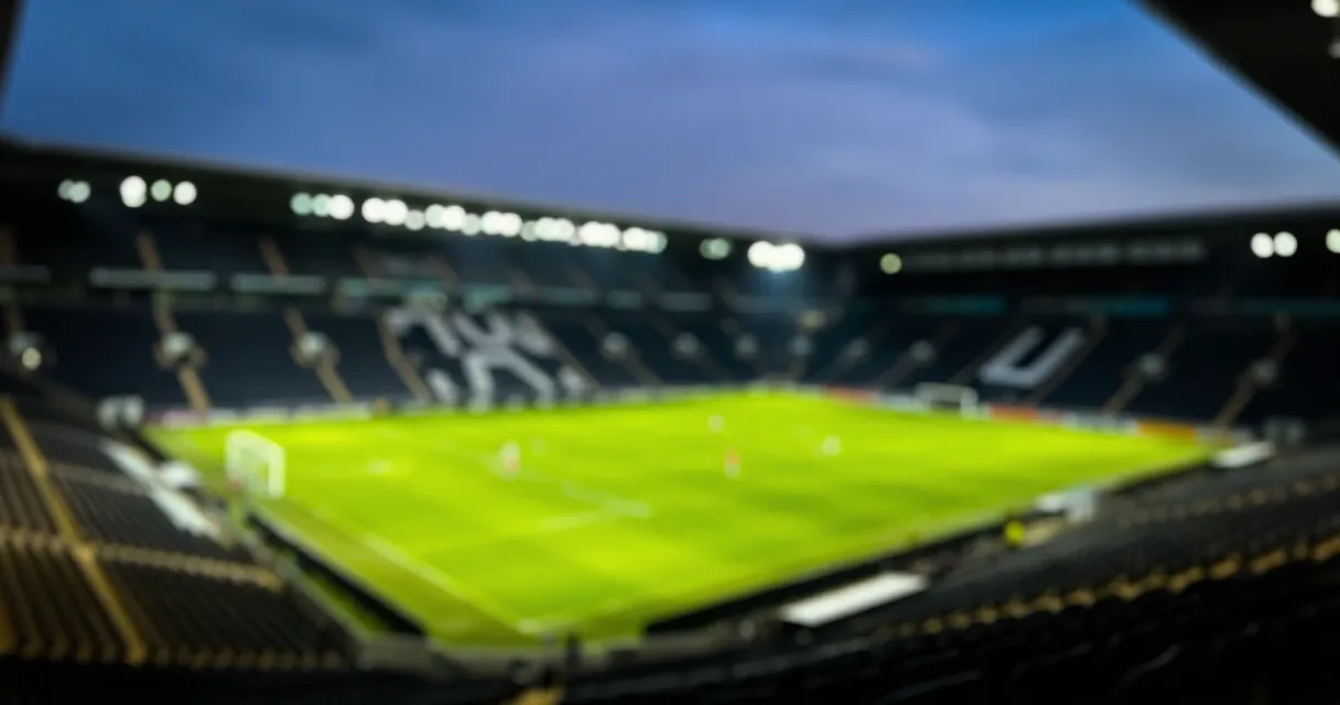 Football stadium at night representing FIFA transfer regulations announcement 2026