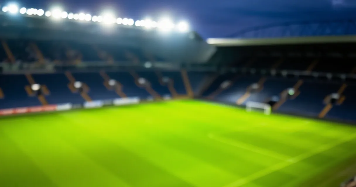 Young footballer walking through stadium tunnel before transfer signing