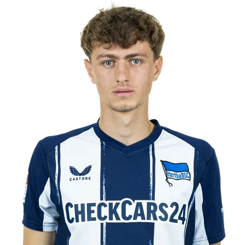 Young Bundesliga midfielder striking a curling shot during a match